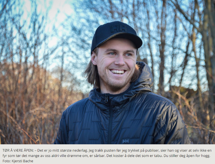 A person smiling in a black hat

Description automatically generated